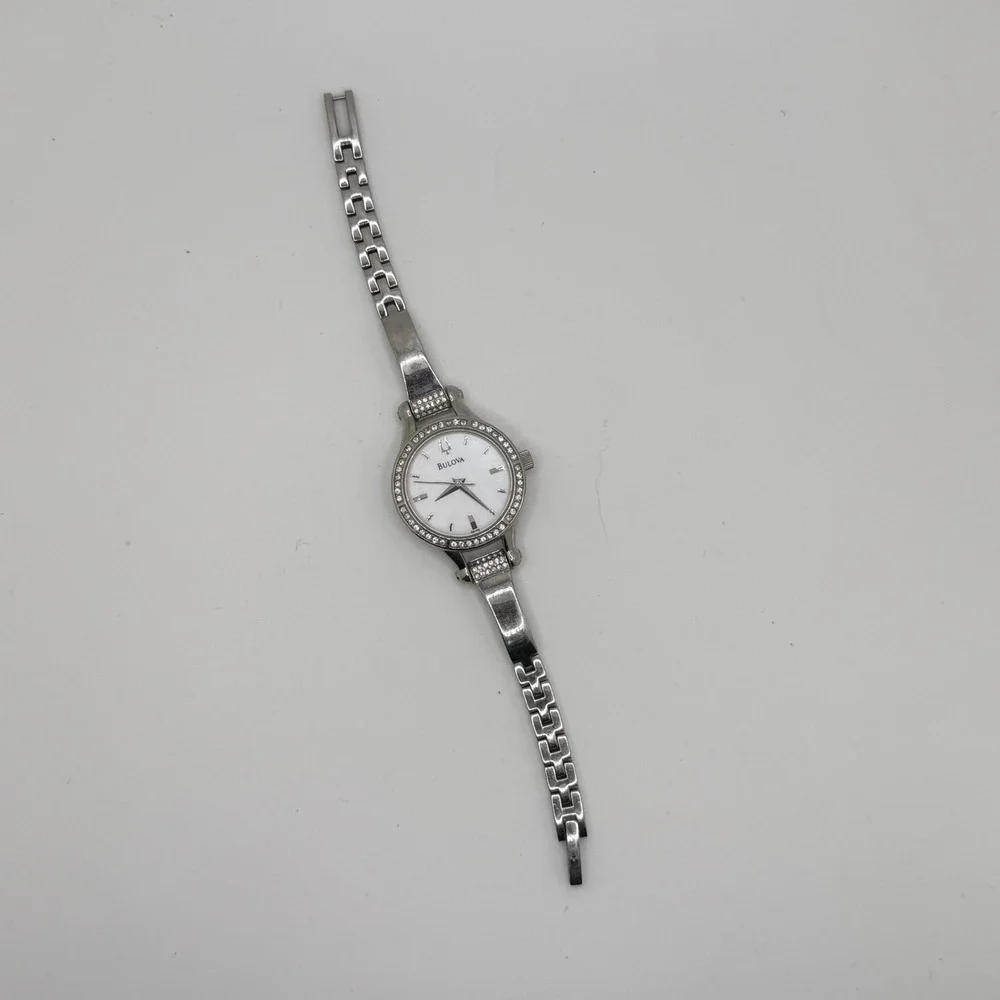 Bulova‎ Women Silver Tone Crystal Bezel White Dial Bangle Watch C869915 READ